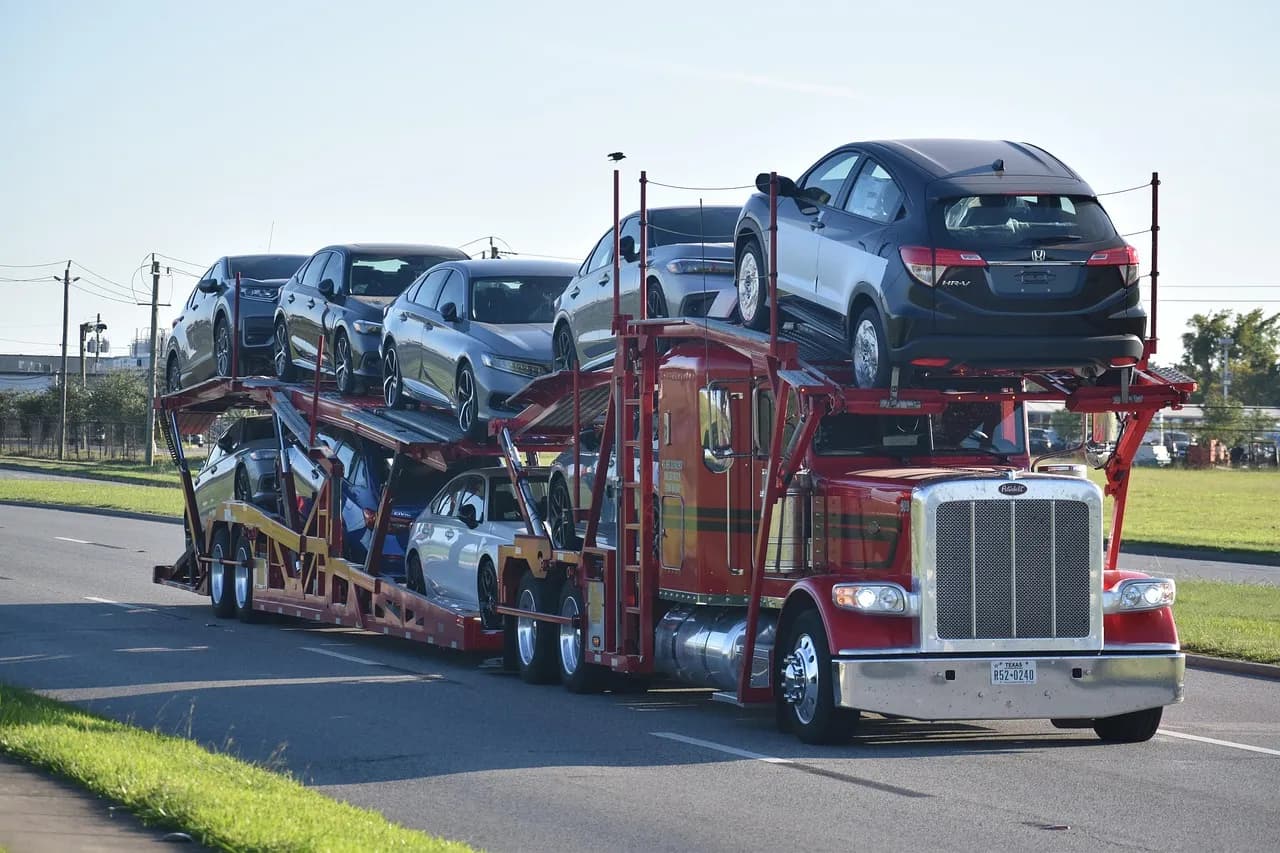 Professional car transporter truck transporting vehicles across America
